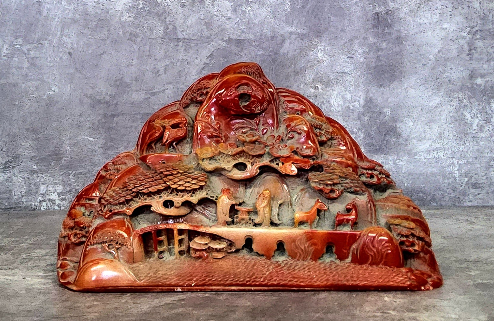 A Chinese carved soapstone scholars calligraphy weight decorated in relief with cranes in flight
