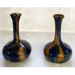 A pair of Art Nouveau globe & stem spilll vases, drip glazed in colbalt blue & ochre 15cms high (2)
