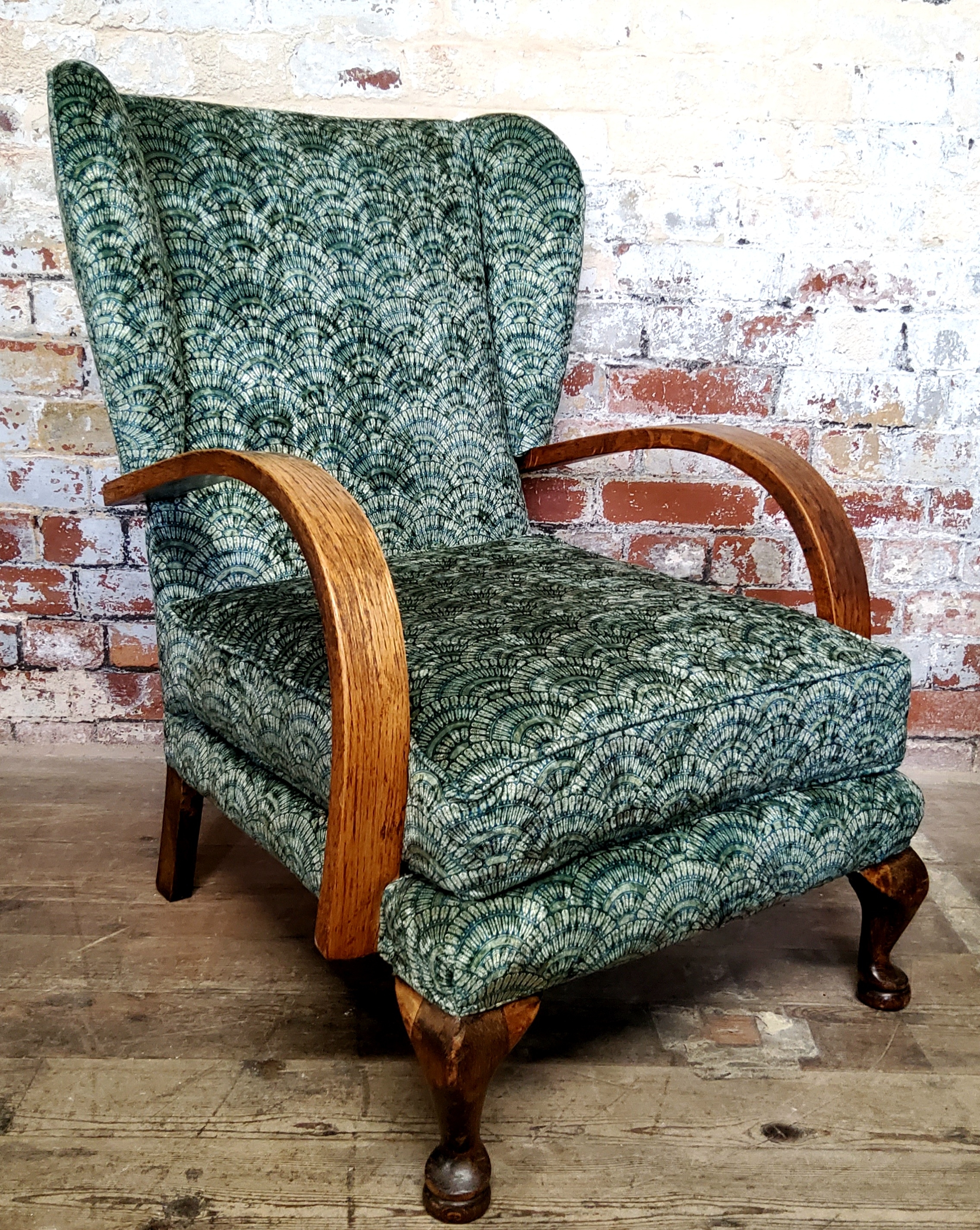 Interior Design - a period Art Deco oak wing back club chair recently upholstered in an emerald