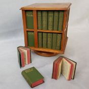 A 19th-century revolving miniature bookcase, containing miniature editions of the work of William