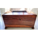 A William IV rosewood tea caddy, of sarcophagus form, the hinged cover enclosing a pair of lidded