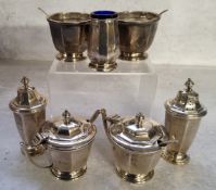 A mid 20th century matching condiment set comprising two peppettes, two salts, two mustard pots