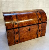 A Victorian walnut Tunbridge Ware parquetry inlaid tea caddy, the hinged domed top opening to reveal