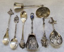 Dutch silver including a cream ladle, the bowl decorated in relief with an angler on a stream, the