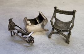 A Dutch silver model of a sleigh, stamped with a crown over XXX, K 28.17g; a continental white metal