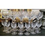 A Stuart Crystal glass suite of hobnail cut knopped stem wine and lacquer glasses