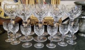 A Stuart Crystal glass suite of hobnail cut knopped stem wine and lacquer glasses