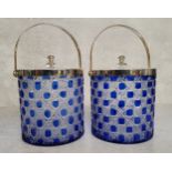 A pair of stylish Bristol blue and clear glass biscuit barrels with silverplated cover and swing