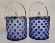 A pair of stylish Bristol blue and clear glass biscuit barrels with silverplated cover and swing