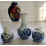 Decorative Ceramics- a Moorcroft miniature ovoid vase, Clematis pattern on deep blue ground,