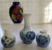 Decorative Ceramics- a Moorcroft miniature ovoid vase, Clematis pattern on deep blue ground,