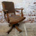 A Globe Wernicke Co, London banker's chair, adjustable settings, raised on castors.  Total