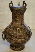 Chinese bronze archaic style temple vase with loop handles, the body engraved throughout with script