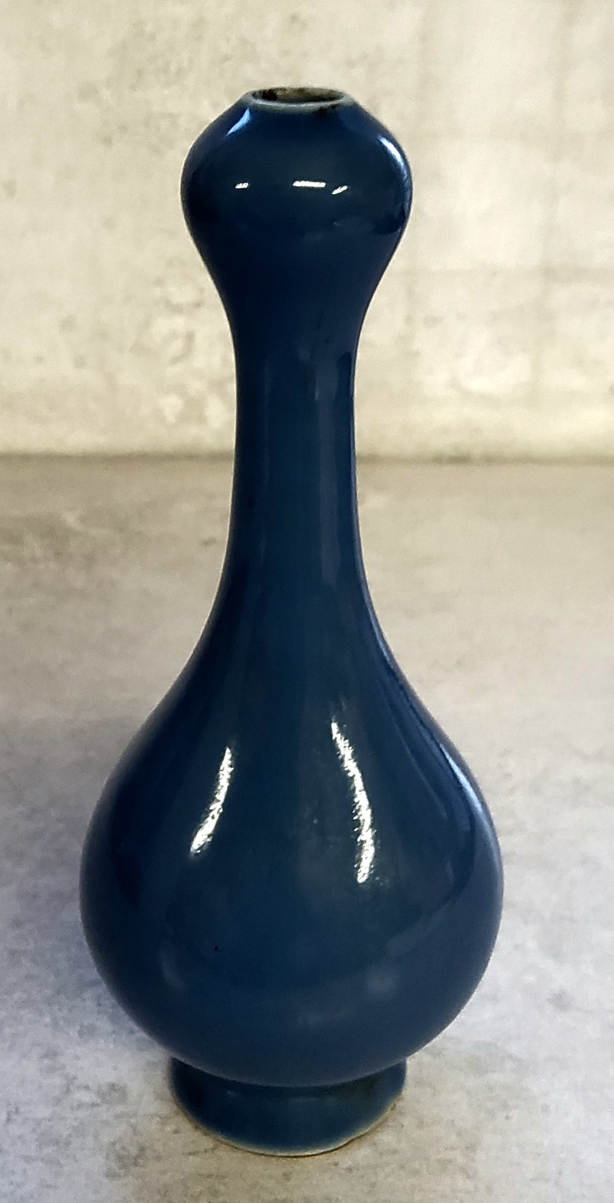 A Chinese double gourd bud vase, powder blue glaze with seal stamped mark to base.