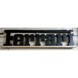 Advertising - a Ferrari wooden wall hanging sign, the letters painted black 112cms x 28cms high