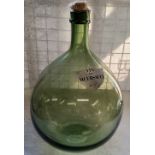 A substantial French carboy / demijohn with a shield shaped label titled " Vin De Meursault " with