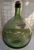 A substantial French carboy / demijohn with a shield shaped label titled " Vin De Meursault " with