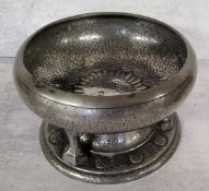 An unusual Celtic style pewter pedestal bowl, the base embossed in relief with Celtic symbols, the