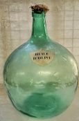 A substantial French carboy / demijohn with shield shaped label titled " Huile D'Olive ", cork