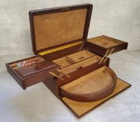 A Morrocan brown leather travel jewellery case, suede lined, fitted interior