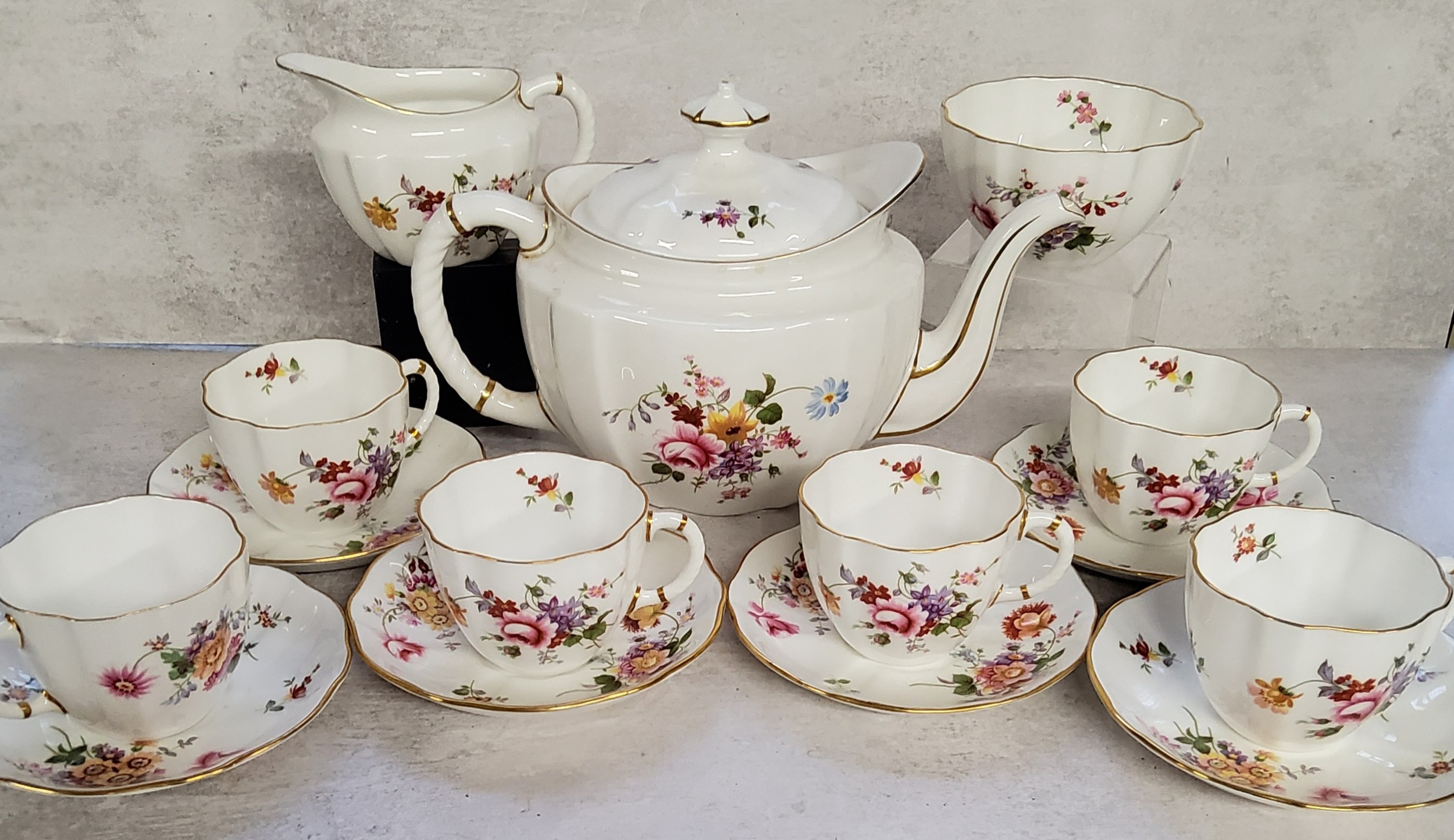A Royal Crown Derby, Derby Posies pattern part tea service for six comprising tea pot, teacups &