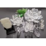 A Swarovski graduated set of three 123 Water Lily candle holders; Swarovski animals including