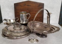 A silverplated swing handled pedestal fruit basket, the rim decorated in relief with scrolls &