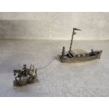 A Dutch silver model of a horse drawn Dutch barge with ride, captain & tiller boy, stamped 68.47g