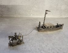 A Dutch silver model of a horse drawn Dutch barge with ride, captain & tiller boy, stamped 68.47g
