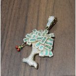 An unusual 9ct gold pendant in the form of a money tree, set with white stones and emeralds 6.
