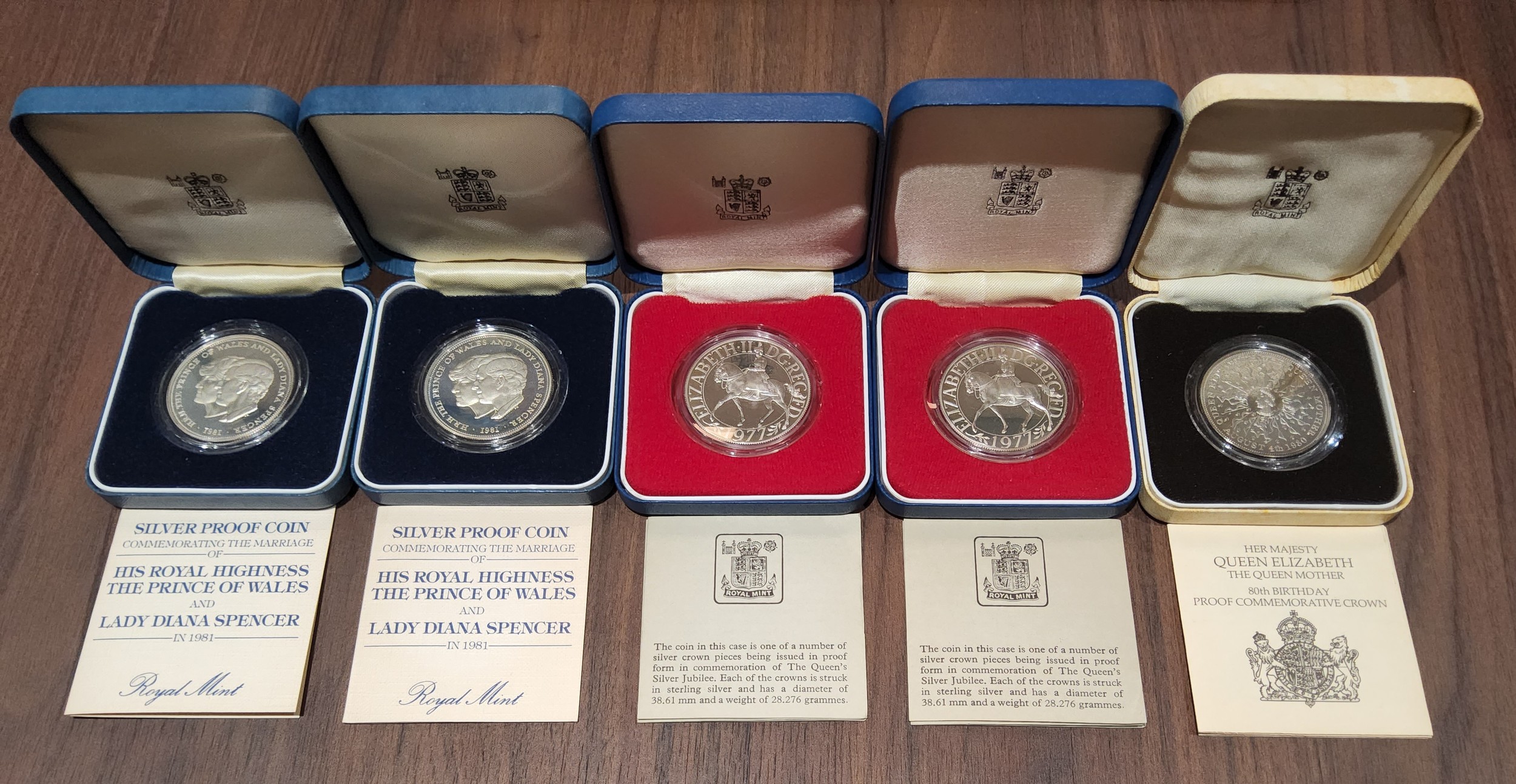 A Royal Mint Silver Proof Silver Jubilee 1977 Crown; another; a Royal Mint Silver 1980 Queen