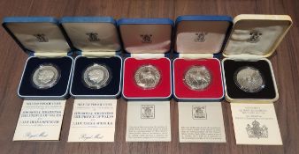 A Royal Mint Silver Proof Silver Jubilee 1977 Crown; another; a Royal Mint Silver 1980 Queen