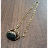 A vintage 9ct gold swivel pendant set with oval cornelian, bloodstone & onyx stones, hallmarked on a