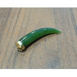 A 9ct gold mounted jade tusk pendant, 6cm long, 10.2g gross