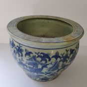 A Chinese underglazed blue and white planter / jardiniere, four character maks for base, goldfish to