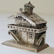 A Dutch silver novelty match safe in the form of a Swiss Chalet, with a pediment roof & chimney, the