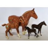 A Beswick Chestnut shire horse, CH Hasse Dainty (af); a Chestnut shire foal; two bay foals (4)