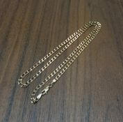 A 9ct gold diamond cut curb 21" necklace, 6.9g