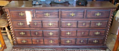 A substantial bank of ten haberdashery drawers, brass batwing escutcheons with drop swing handles,