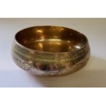 An Eastern bronze ceremonial singing prayer bowl, chased throughout.