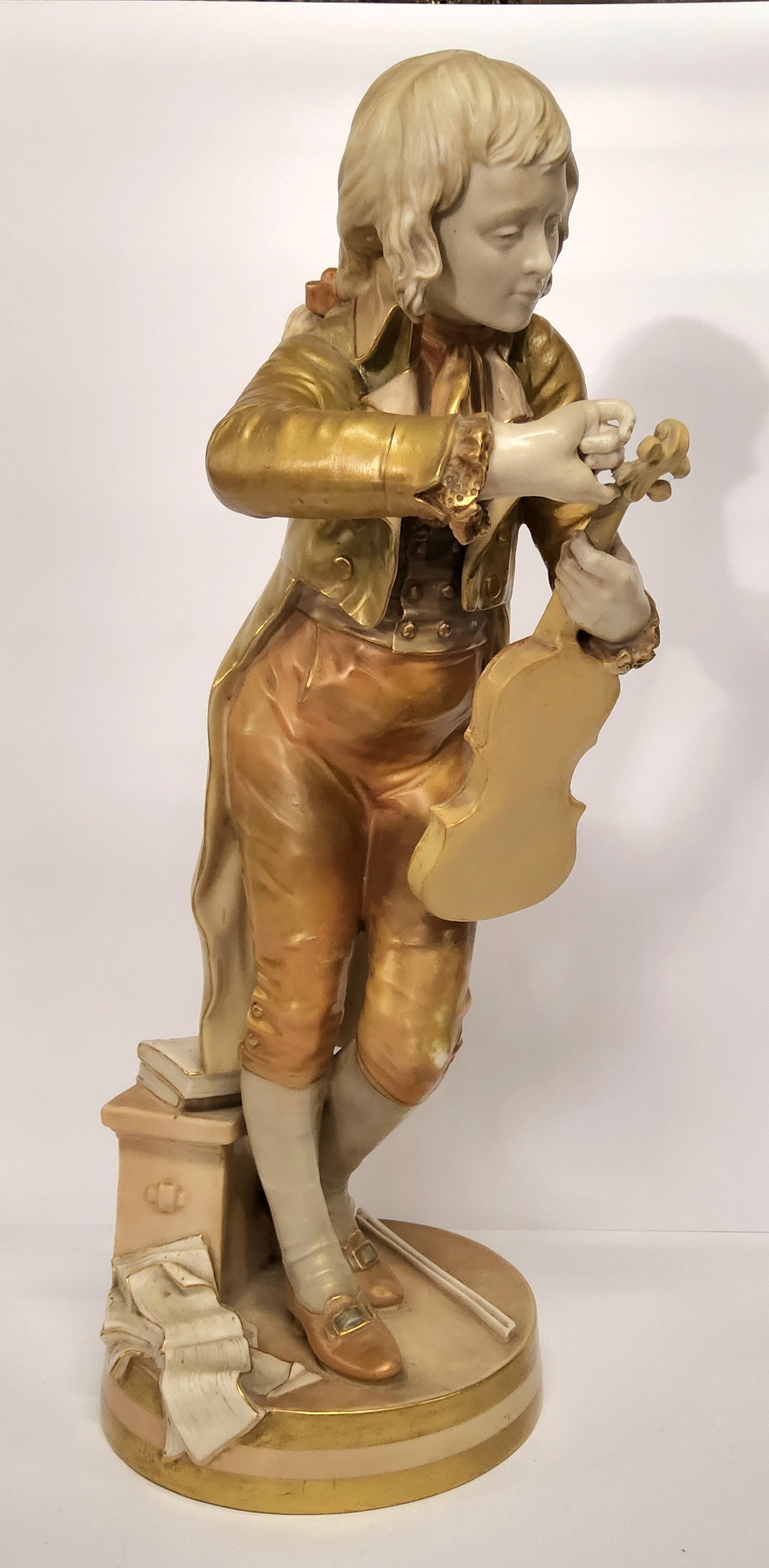 A large Royal Worcester figure, The Violinist/The Young Mozart, possibly modelled by Thomas Brock,