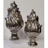 A pair of contemporary silver glazed ceramic torch shaped ornamental finials by Eichholtz. 41cm high