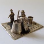 A Dutch 833 silver figural group of a mother & daughter making butter, J. van Dijk, Hoorn,