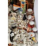 A quantity of novelty crested ware trinkets, commemorative ware, Satsuma tea service, etc