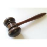 An antique turned treen gavel