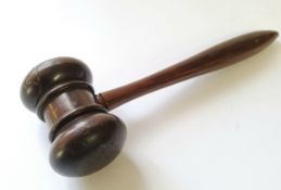 An antique turned treen gavel