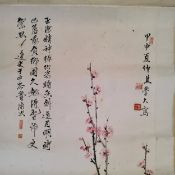 An early 20th century Chinese hanging calligraphy scroll, Qing dynasty, painted with a bird