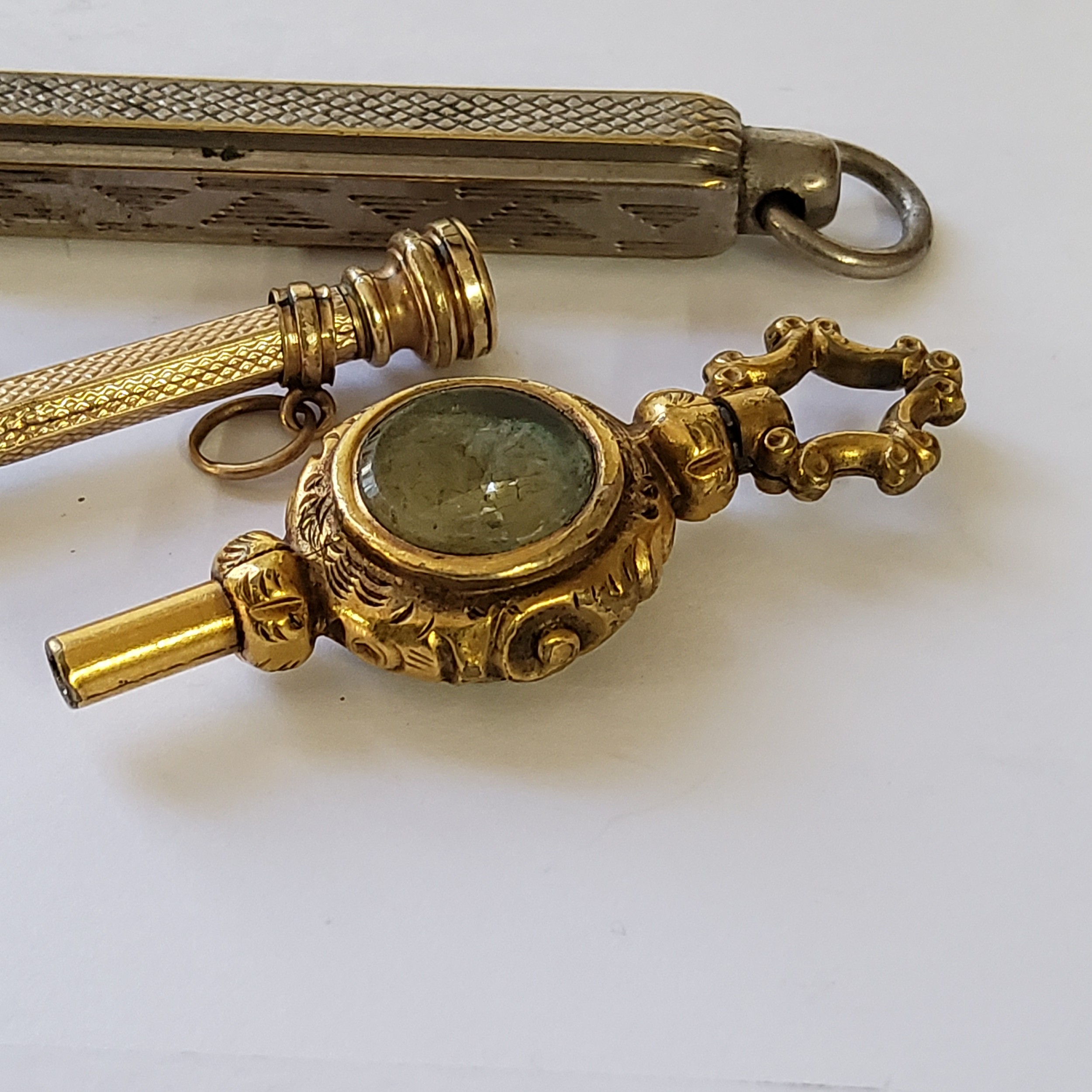 A Victorian gilt metal pocket watch key; a Victorian yellow metal slide pencil fob, set with a - Image 2 of 2
