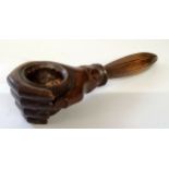 Treen - an unusual 19th century Swiss carved wood nut cracker in the form of closing hand, turn