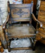 A 17th century style country house hall chair, ecclesiastical in taste. Carved panel back c.1880